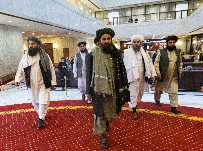 Taliban co-founder Mullah Abdul Ghani Baradar, center, arrives with other members of the Taliban delegation for an international peace conference in Moscow in March.